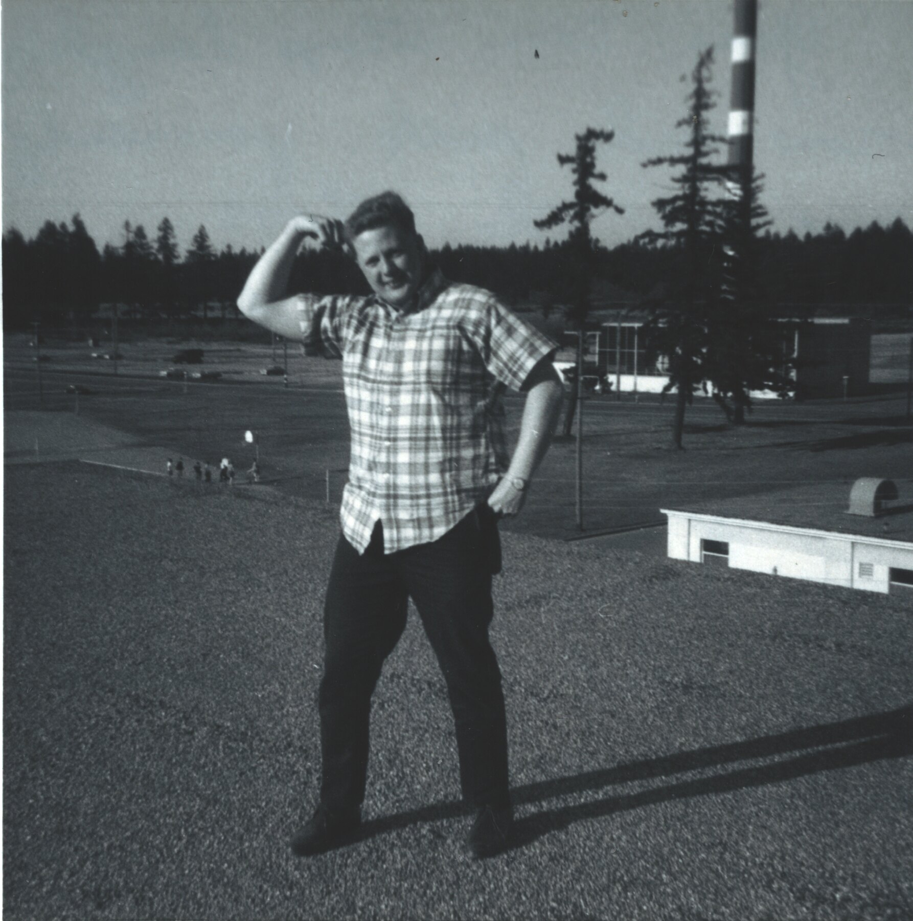 Young Tom Snyder standing outdoors during his Army service