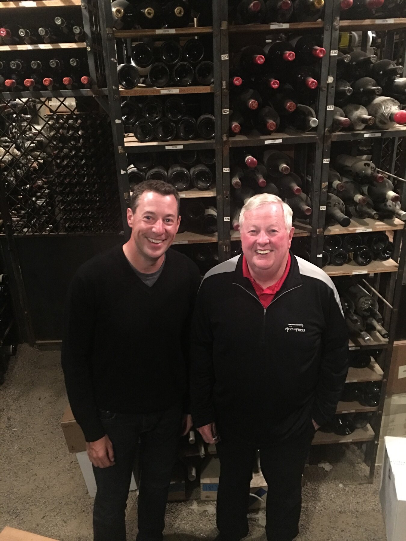 Tom Snyder with a friend in a wine cellar